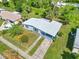 Aerial view of the home, showcasing its well-kept yard and charming curb appeal at 22219 Catherine Ave, Port Charlotte, FL 33952
