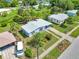 An aerial view of a home with a well-maintained yard and a light blue exterior at 22219 Catherine Ave, Port Charlotte, FL 33952