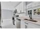 Bright kitchen with white cabinets, stainless steel appliances, and quartz countertops at 22219 Catherine Ave, Port Charlotte, FL 33952