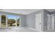 Bright room with large windows providing plenty of natural light and white tile flooring at 22219 Catherine Ave, Port Charlotte, FL 33952