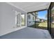 Screened patio providing a great view of the lush backyard, perfect for enjoying outdoor living at 22219 Catherine Ave, Port Charlotte, FL 33952