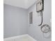Bright utility room featuring a tankless water heater and durable, easy-to-clean floors at 22219 Catherine Ave, Port Charlotte, FL 33952