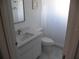 A bright bathroom features a new vanity with modern fixtures and clean white finishes at 23167 Turnbull Ave, Port Charlotte, FL 33954