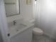 Bathroom with a toilet, sink, and shower featuring modern updates at 23167 Turnbull Ave, Port Charlotte, FL 33954