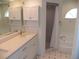 Elegant bathroom features dual sinks, a soaking tub, and a separate shower at 23167 Turnbull Ave, Port Charlotte, FL 33954