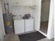 Inside laundry room with a washer, dryer, and water heater at 23167 Turnbull Ave, Port Charlotte, FL 33954