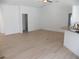 Open-concept living room with new flooring and abundant natural light at 23167 Turnbull Ave, Port Charlotte, FL 33954