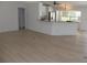 Spacious living room showcasing new floors and an open floorplan to the kitchen at 23167 Turnbull Ave, Port Charlotte, FL 33954