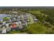 A high angle neighborhood shot showing the community homes, greenery, and surrounding lakes, great for establishing roots at 2477 Gabel Oak Dr, North Port, FL 34289