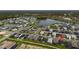 An aerial showing the community neighborhood layout, abundant greenery, and multiple lakes, perfect for a peaceful retreat at 2477 Gabel Oak Dr, North Port, FL 34289