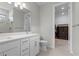 Elegant bathroom with double sink vanity, quartz countertops, and ample storage at 2477 Gabel Oak Dr, North Port, FL 34289