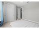 Neutral bedroom with light carpet and large closet with double doors at 2477 Gabel Oak Dr, North Port, FL 34289