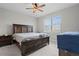 Comfortable bedroom with ceiling fan and a large window for natural light at 2477 Gabel Oak Dr, North Port, FL 34289