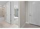 Hallway view showcasing a bedroom and bathroom layout at 2477 Gabel Oak Dr, North Port, FL 34289