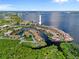 Stunning aerial view of waterfront homes with boat docks and surrounding landscaping and beautiful water views at 25188 Marion Ave # 45, Punta Gorda, FL 33950