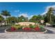 Welcoming entrance to Emerald Pointe with lush landscaping and elegant signage creating a grand arrival at 25188 Marion Ave # 45, Punta Gorda, FL 33950