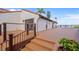 Elegant exterior featuring a spacious deck with waterfront seating and stairs leading from the outdoor living space at 25188 Marion Ave # 45, Punta Gorda, FL 33950