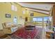 Spacious living room with high ceilings, hardwood floors, and large windows with a water view at 25188 Marion Ave # 45, Punta Gorda, FL 33950