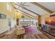 Spacious living room with high ceilings, hardwood floors, a fireplace, and large windows with a water view at 25188 Marion Ave # 45, Punta Gorda, FL 33950