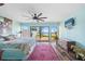 Beautiful main bedroom with a ceiling fan and serene view at 25188 Marion Ave # 45, Punta Gorda, FL 33950