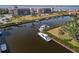 Scenic waterfront with boats docked along a canal, surrounded by condos and manicured green spaces at 25188 Marion Ave # 45, Punta Gorda, FL 33950