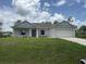 Charming single-story home with a well-manicured lawn and inviting curb appeal at 2534 Longworthy Rd, North Port, FL 34288