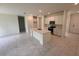 Modern kitchen with an island, stainless steel appliances, and sleek cabinetry at 2534 Longworthy Rd, North Port, FL 34288