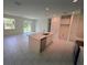 Open-concept kitchen with island, modern appliances, and plenty of counter space at 2534 Longworthy Rd, North Port, FL 34288
