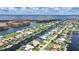 Aerial view of a neighborhood's home on a canal, close to the ocean and other homes at 2815 Coral Way, Punta Gorda, FL 33950