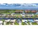 Aerial view of a waterfront neighborhood featuring lush landscaping, canal access, and stunning water views at 2815 Coral Way, Punta Gorda, FL 33950