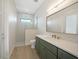 Bathroom boasts a modern shower, stylish vanity with gold accents, and sleek fixtures at 2815 Coral Way, Punta Gorda, FL 33950