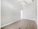 Spacious bedroom with wood-look tile flooring, a modern ceiling fan, and neutral-toned walls at 2815 Coral Way, Punta Gorda, FL 33950