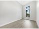 Bright, airy bedroom featuring modern windows, light wood floors, and fresh white walls at 2815 Coral Way, Punta Gorda, FL 33950