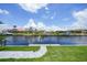 This stunning canal view features docks, boats, and picturesque waterfront homes on a sunny day at 2815 Coral Way, Punta Gorda, FL 33950