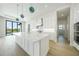 Bright kitchen with stainless-steel appliances and a center island with a sink at 2815 Coral Way, Punta Gorda, FL 33950