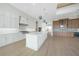 A modern kitchen featuring stainless steel appliances, a large island, and pendant lighting at 2815 Coral Way, Punta Gorda, FL 33950