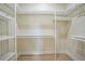 Walk-in closet with ample shelving units, allowing for maximum storage and organization at 2815 Coral Way, Punta Gorda, FL 33950