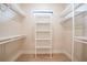Spacious walk-in closet offering shelving and plenty of vertical storage, ideal for organization at 2815 Coral Way, Punta Gorda, FL 33950