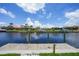 Beautiful waterfront view showing neighborhood homes, and boat docks on a sunny day at 2815 Coral Way, Punta Gorda, FL 33950