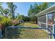 Fenced backyard with lush greenery, offering privacy and space for outdoor activities at 3197 Normandy Dr, Port Charlotte, FL 33952