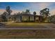 Charming single-story home with a covered carport and screened porch, perfect for enjoying the outdoors at 3197 Normandy Dr, Port Charlotte, FL 33952