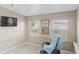 A cozy sunroom featuring large windows, a comfortable chair, and tile flooring, perfect for relaxation at 3197 Normandy Dr, Port Charlotte, FL 33952