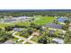 Spacious property with a large backyard, pool, and lush landscaping surrounded by mature trees in a desirable neighborhood at 3305 Nansen Ln, North Port, FL 34286
