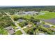 Aerial view of property highlighting the large lot, mature trees, and screened-in pool at 3305 Nansen Ln, North Port, FL 34286