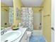 Well-lit bathroom featuring a shower/tub combination, vanity with countertop, and natural light at 3305 Nansen Ln, North Port, FL 34286