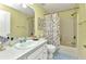 Inviting bathroom featuring a shower/tub combination, vanity with countertop, and natural light at 3305 Nansen Ln, North Port, FL 34286
