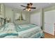 Inviting bedroom showcasing a cozy bed with wrought iron frame, natural light, and closet at 3305 Nansen Ln, North Port, FL 34286