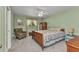 Comfortable bedroom with a ceiling fan, carpeted floors, and a window at 3305 Nansen Ln, North Port, FL 34286