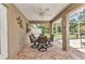 Entertain in style with a patio dining set on the lanai overlooking the screened pool at 3305 Nansen Ln, North Port, FL 34286