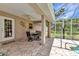 Charming covered patio has beautiful stone and is perfect for indoor-outdoor flow at 3305 Nansen Ln, North Port, FL 34286